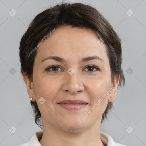 Joyful white adult female with medium  brown hair and brown eyes