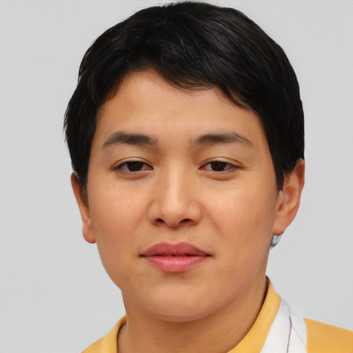 Joyful asian young-adult female with short  brown hair and brown eyes