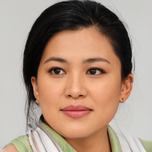 Joyful asian young-adult female with medium  black hair and brown eyes