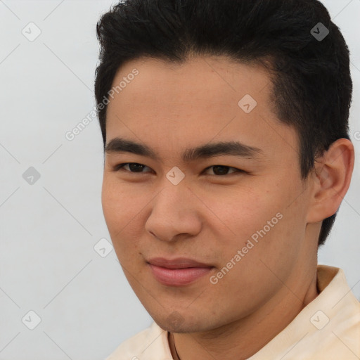 Joyful asian young-adult male with short  brown hair and brown eyes