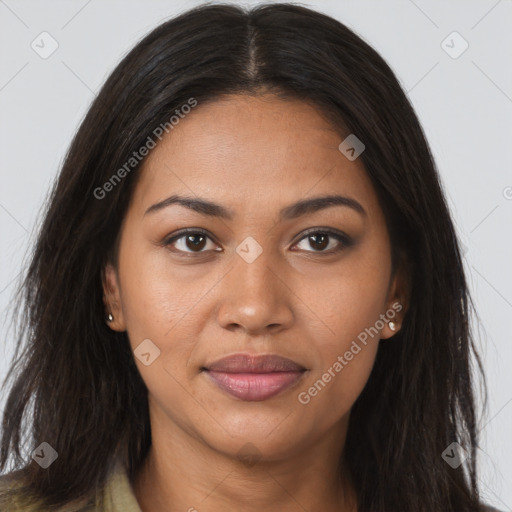 Joyful latino young-adult female with long  brown hair and brown eyes