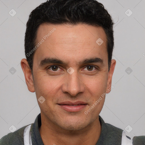 Joyful white young-adult male with short  black hair and brown eyes