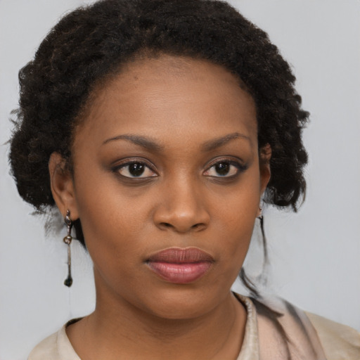 Neutral black young-adult female with medium  brown hair and brown eyes