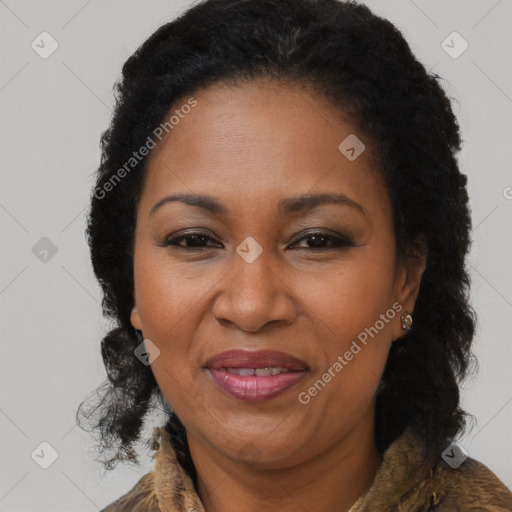 Joyful black adult female with long  brown hair and brown eyes