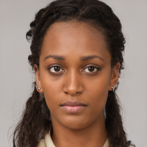 Neutral black young-adult female with long  brown hair and brown eyes