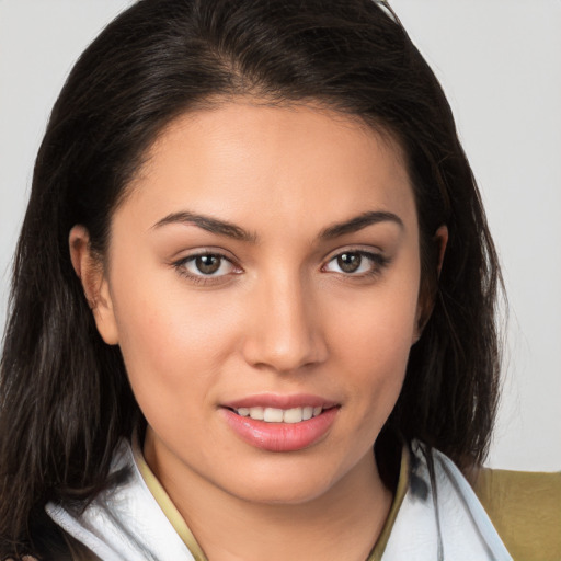 Joyful white young-adult female with medium  brown hair and brown eyes