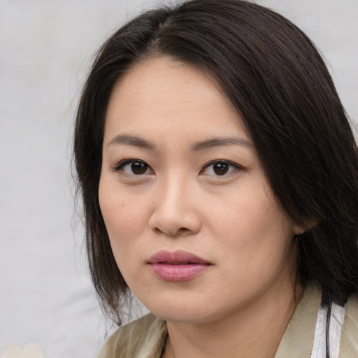 Neutral asian young-adult female with medium  brown hair and brown eyes