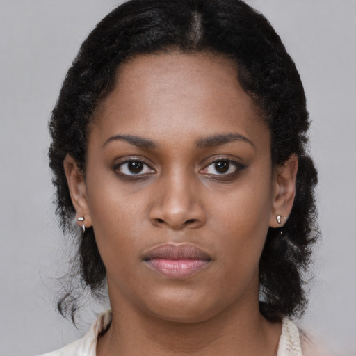 Neutral black young-adult female with short  black hair and brown eyes
