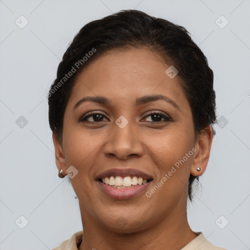 Joyful latino young-adult female with short  brown hair and brown eyes