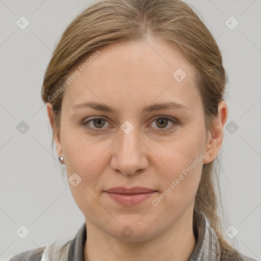 Joyful white adult female with medium  brown hair and grey eyes