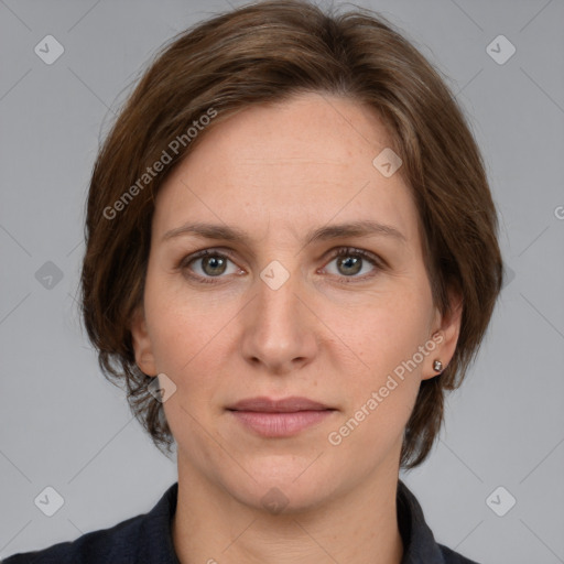 Joyful white adult female with medium  brown hair and grey eyes