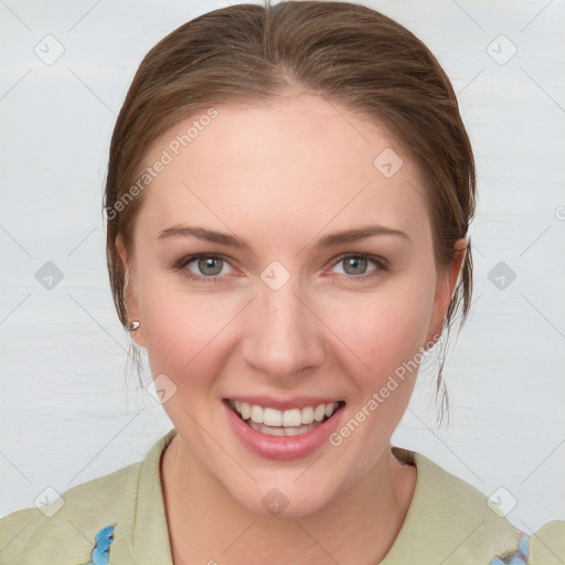 Joyful white young-adult female with medium  brown hair and blue eyes