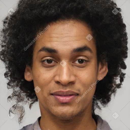 Joyful black young-adult male with short  brown hair and brown eyes