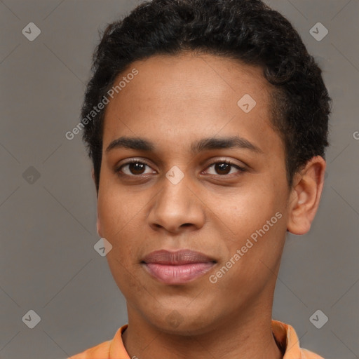 Joyful latino young-adult male with short  brown hair and brown eyes