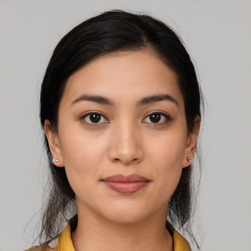 Joyful latino young-adult female with medium  black hair and brown eyes