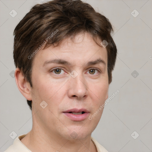 Joyful white adult male with short  brown hair and grey eyes