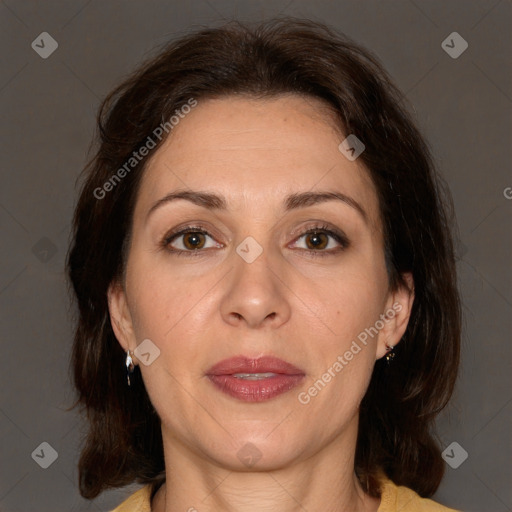 Joyful white adult female with medium  brown hair and brown eyes