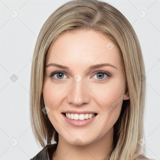 Joyful white young-adult female with long  brown hair and blue eyes