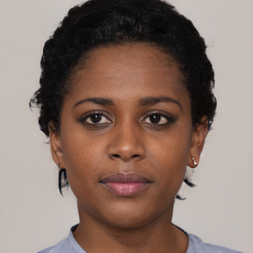 Neutral black young-adult female with short  black hair and brown eyes