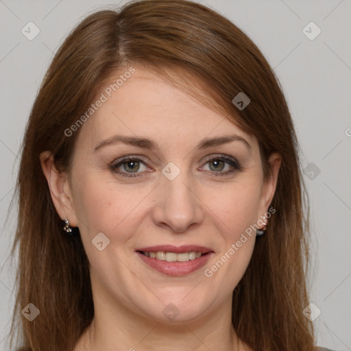 Joyful white adult female with long  brown hair and grey eyes