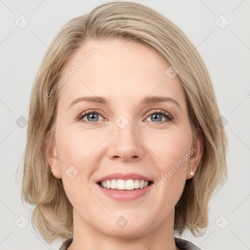 Joyful white young-adult female with medium  brown hair and blue eyes