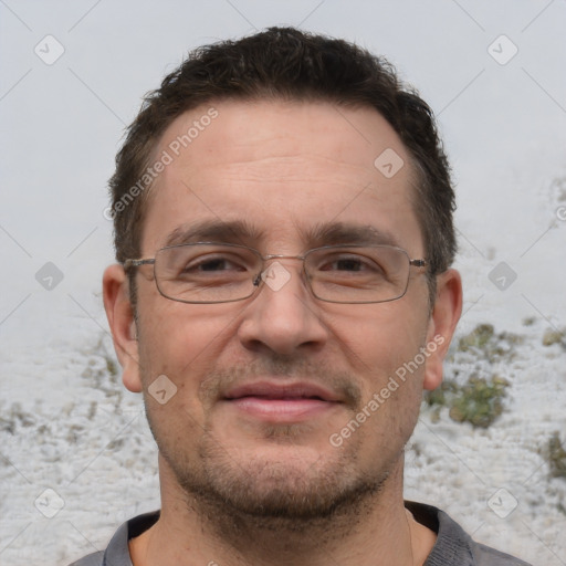 Joyful white adult male with short  brown hair and brown eyes