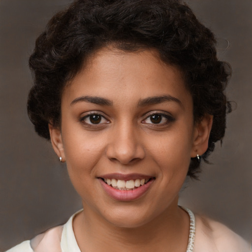 Joyful latino young-adult female with short  brown hair and brown eyes