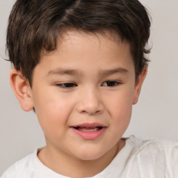 Joyful white child male with short  brown hair and brown eyes