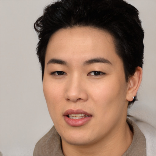 Joyful asian young-adult female with short  brown hair and brown eyes