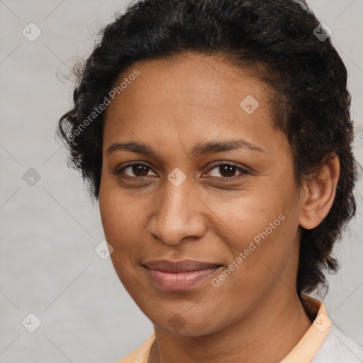 Joyful black adult female with short  brown hair and brown eyes