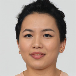 Joyful asian young-adult female with short  black hair and brown eyes