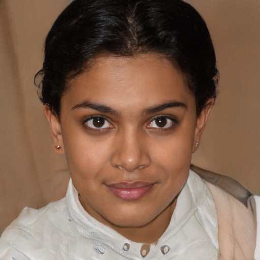 Joyful latino young-adult female with short  brown hair and brown eyes