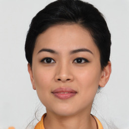 Joyful asian young-adult female with short  brown hair and brown eyes