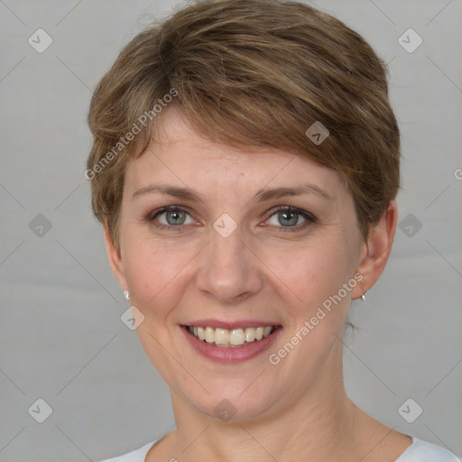 Joyful white young-adult female with medium  brown hair and grey eyes