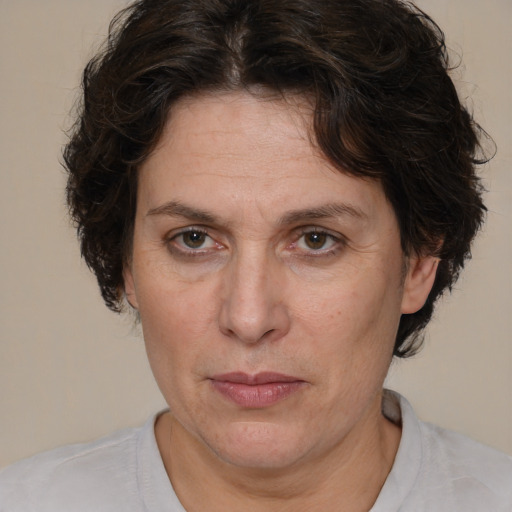 Joyful white adult female with short  brown hair and brown eyes