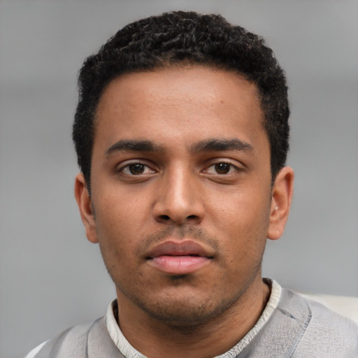 Neutral black young-adult male with short  black hair and brown eyes