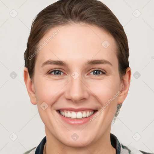 Joyful white young-adult female with short  brown hair and grey eyes