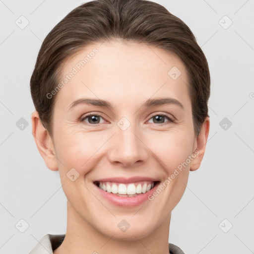 Joyful white young-adult female with short  brown hair and brown eyes