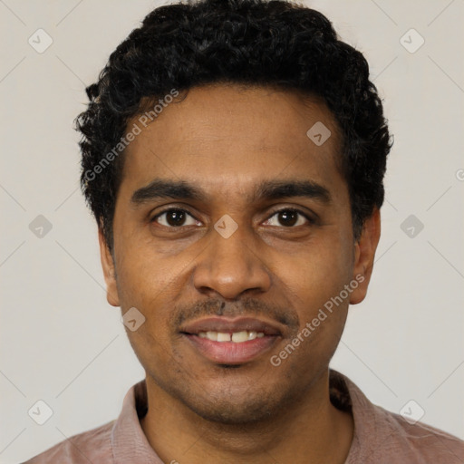 Joyful black young-adult male with short  black hair and brown eyes