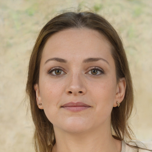 Joyful white young-adult female with medium  brown hair and grey eyes