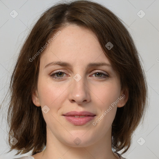 Joyful white young-adult female with medium  brown hair and green eyes