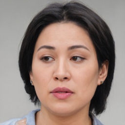 Neutral asian young-adult female with medium  brown hair and brown eyes