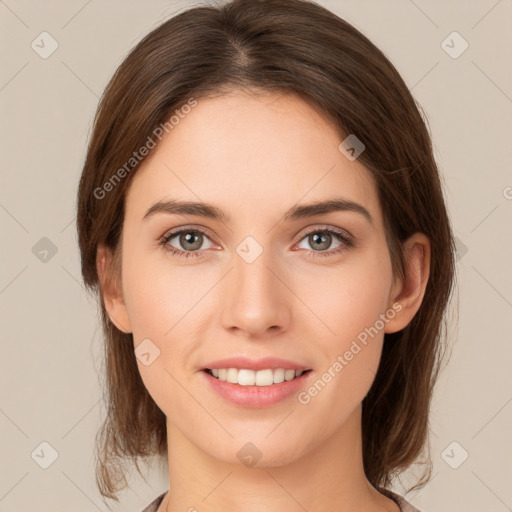 Joyful white young-adult female with medium  brown hair and green eyes