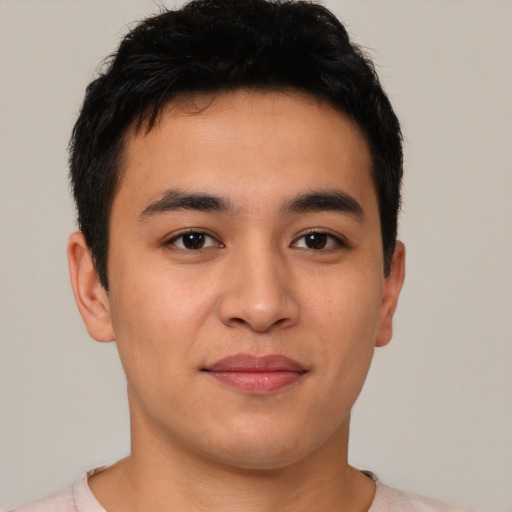 Joyful asian young-adult male with short  brown hair and brown eyes