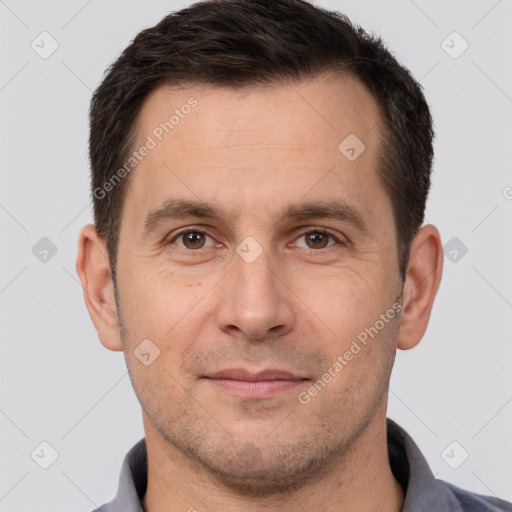 Joyful white adult male with short  brown hair and brown eyes