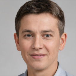 Joyful white adult male with short  brown hair and brown eyes