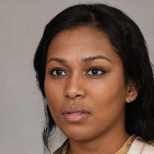 Neutral black young-adult female with medium  black hair and brown eyes