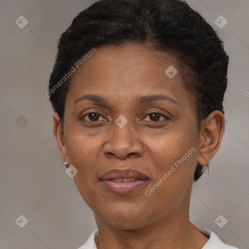 Joyful black adult female with short  brown hair and brown eyes