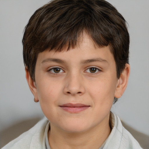 Joyful white child male with short  brown hair and brown eyes