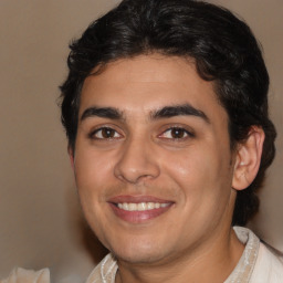 Joyful white young-adult male with medium  brown hair and brown eyes